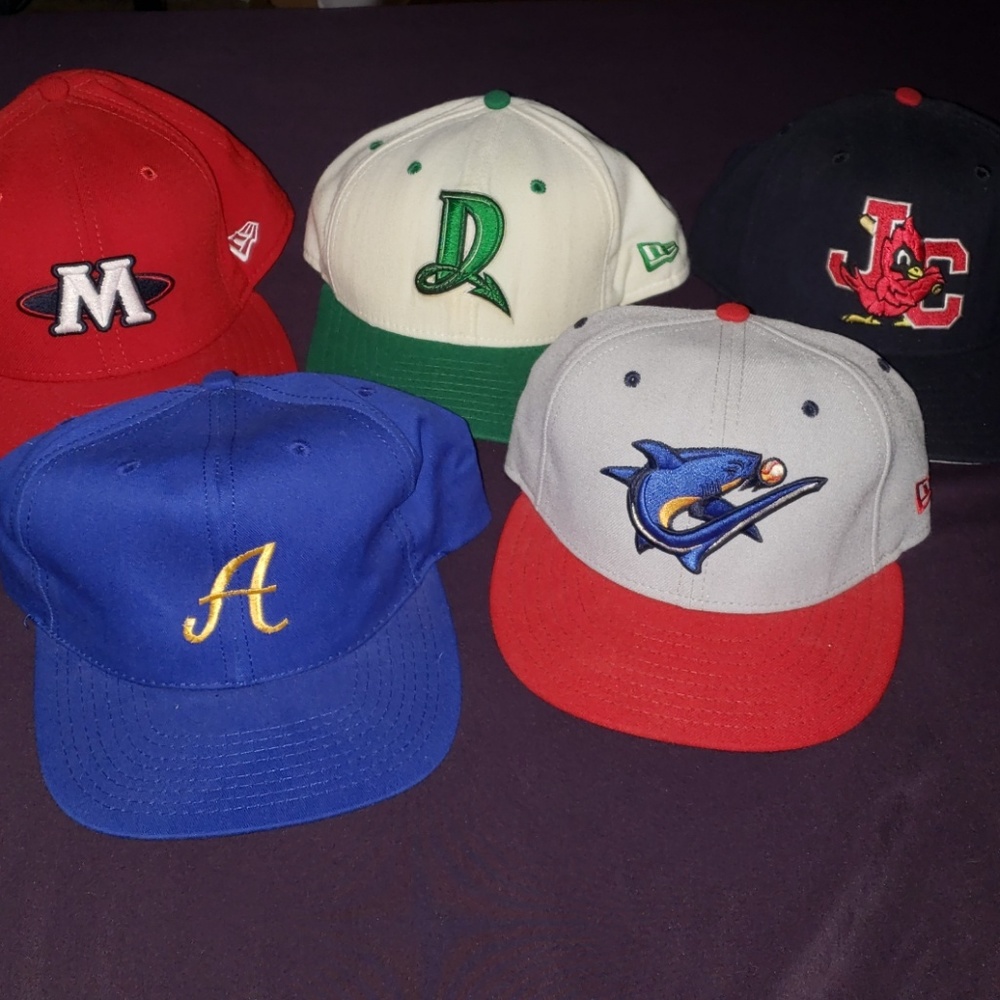 Lots of different new era minor league baseball